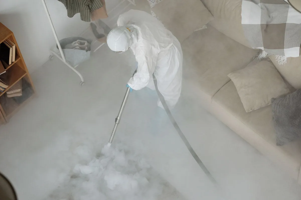 Biohazard cleanup technician in protective equipment, West Carson, CA